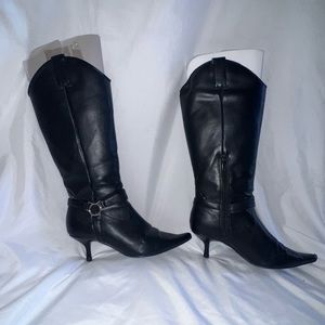 Synthetic black boots.